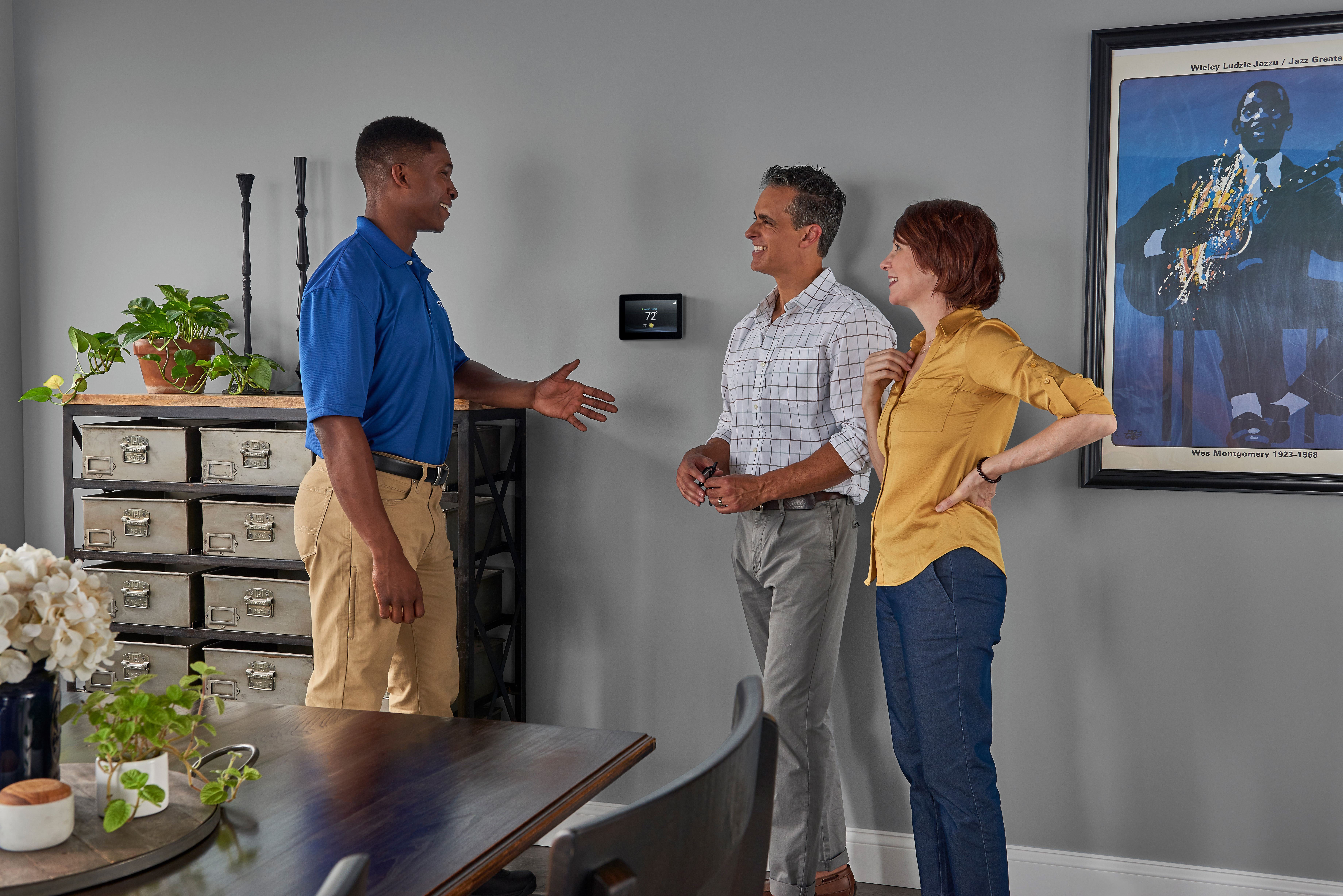 Couple happy with new installed thermostat