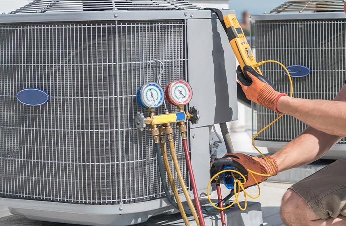 Worker using heat load calculator