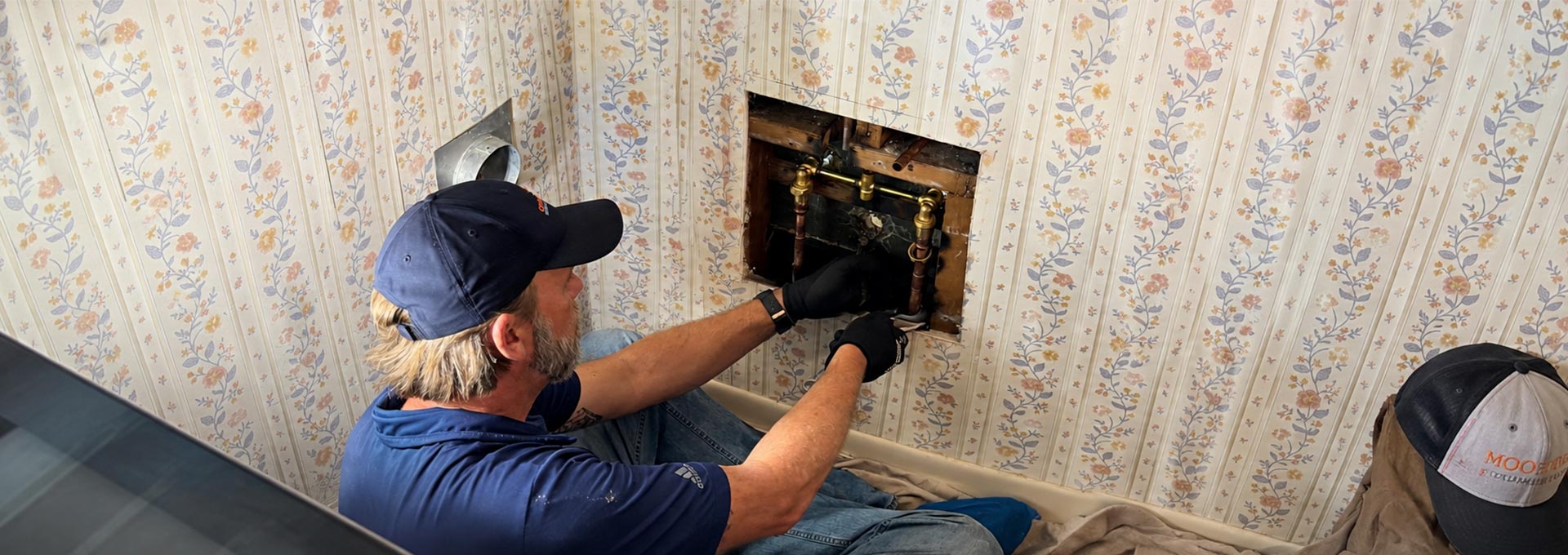 Plumber repairing copper pipes