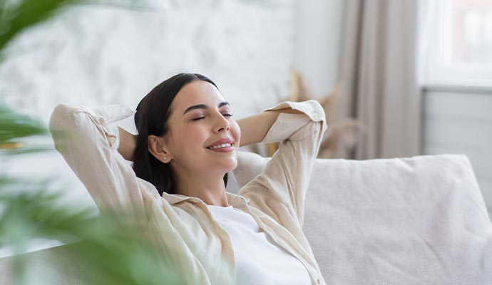 A woman enjoying clean indoor air quality