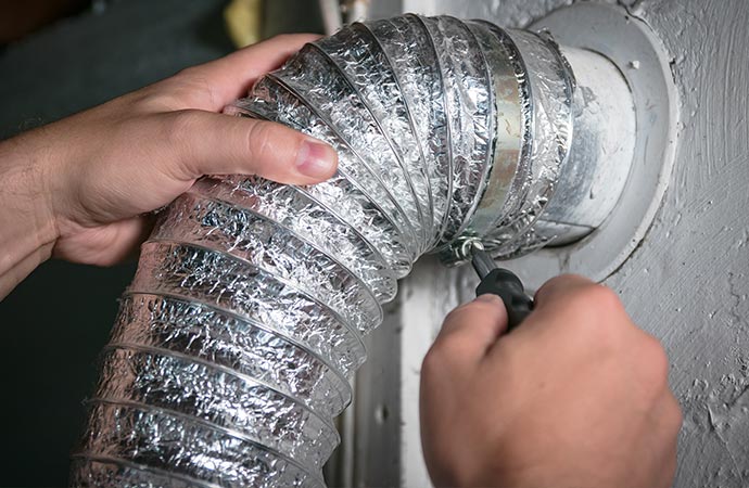 Worker repairing duct work