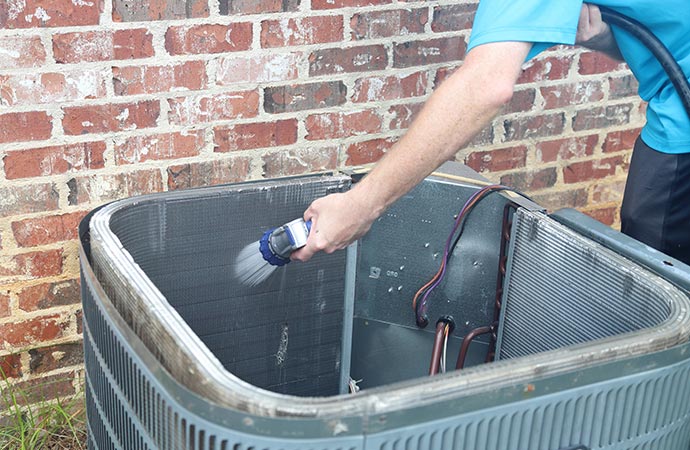 hand deep cleaning hvac heat pump condenser coils
