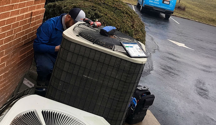 Expert replacing HVAC unit