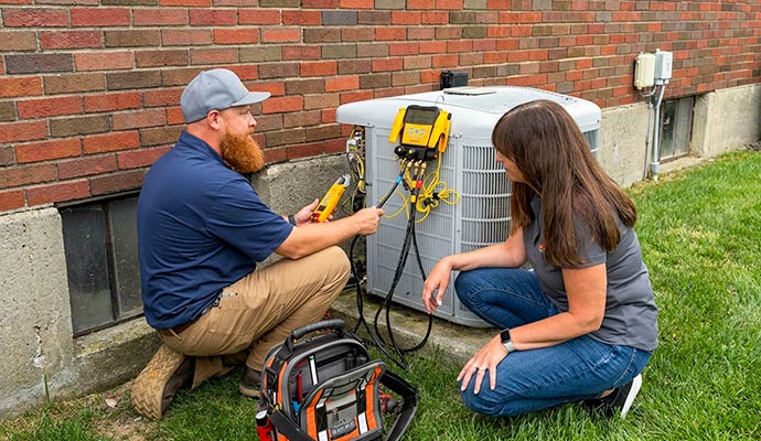 Expert testing HVAC with tools