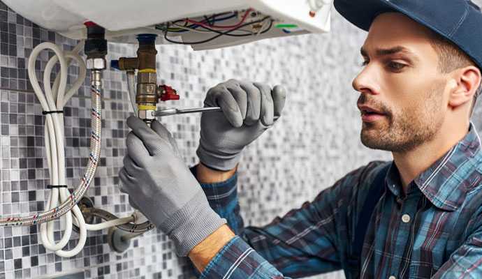 Technician repair a tankless water heater valve