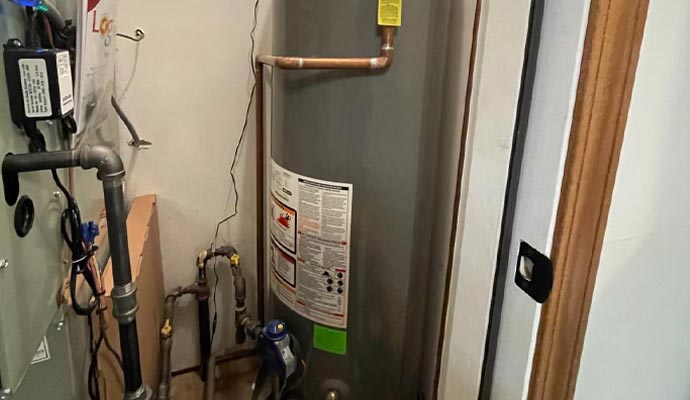 Installed gas water heater with gas and water piping