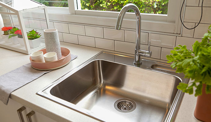 Modern stainless steel kitchen sink with faucet