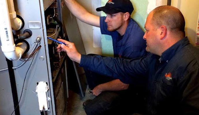 Professional worker maintaining Heating system