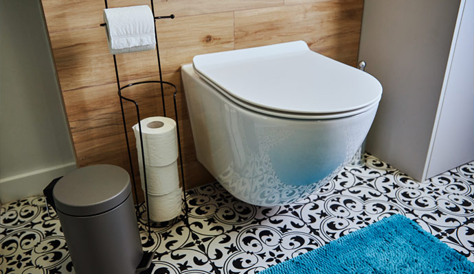 Modern bathroom toilet with patterned tiles
