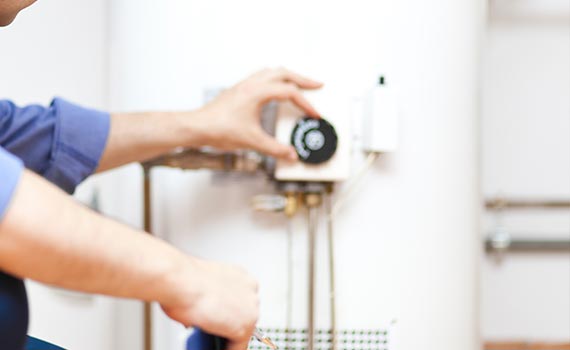 a man inspecting water heater