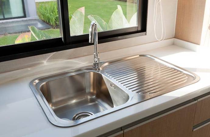 Residential kitchen sink with a modern faucet