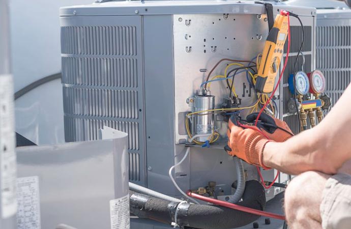 Technician examine heat load of your ac unit