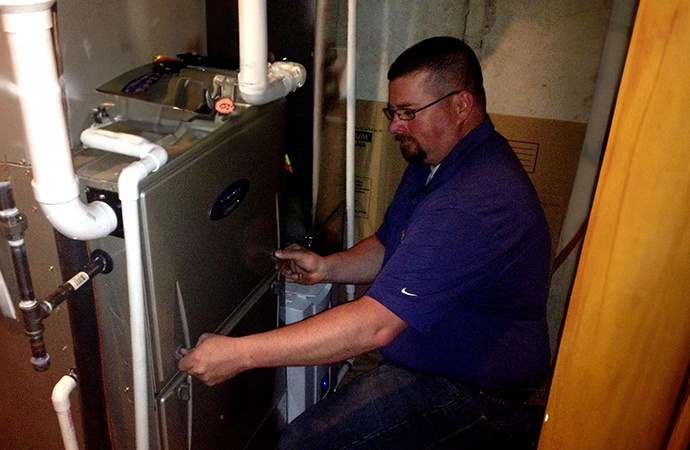 Experienced professional resolving furnace problems at home for efficient heating.