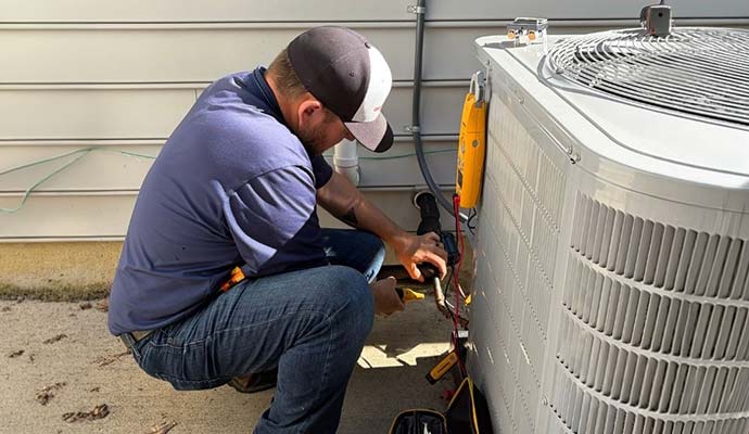 Professional staff repairing outdoor air conditioner