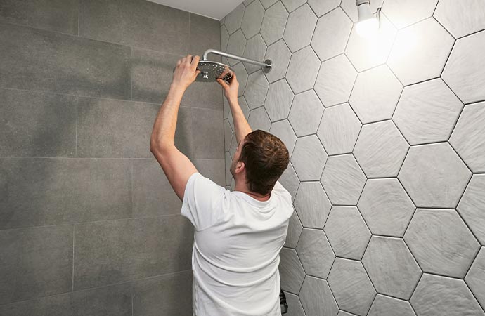 Worker repairing a showerhead