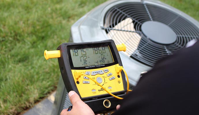 Worker inspecting heating system