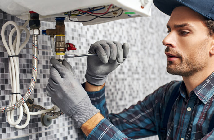 technician repairing heating system